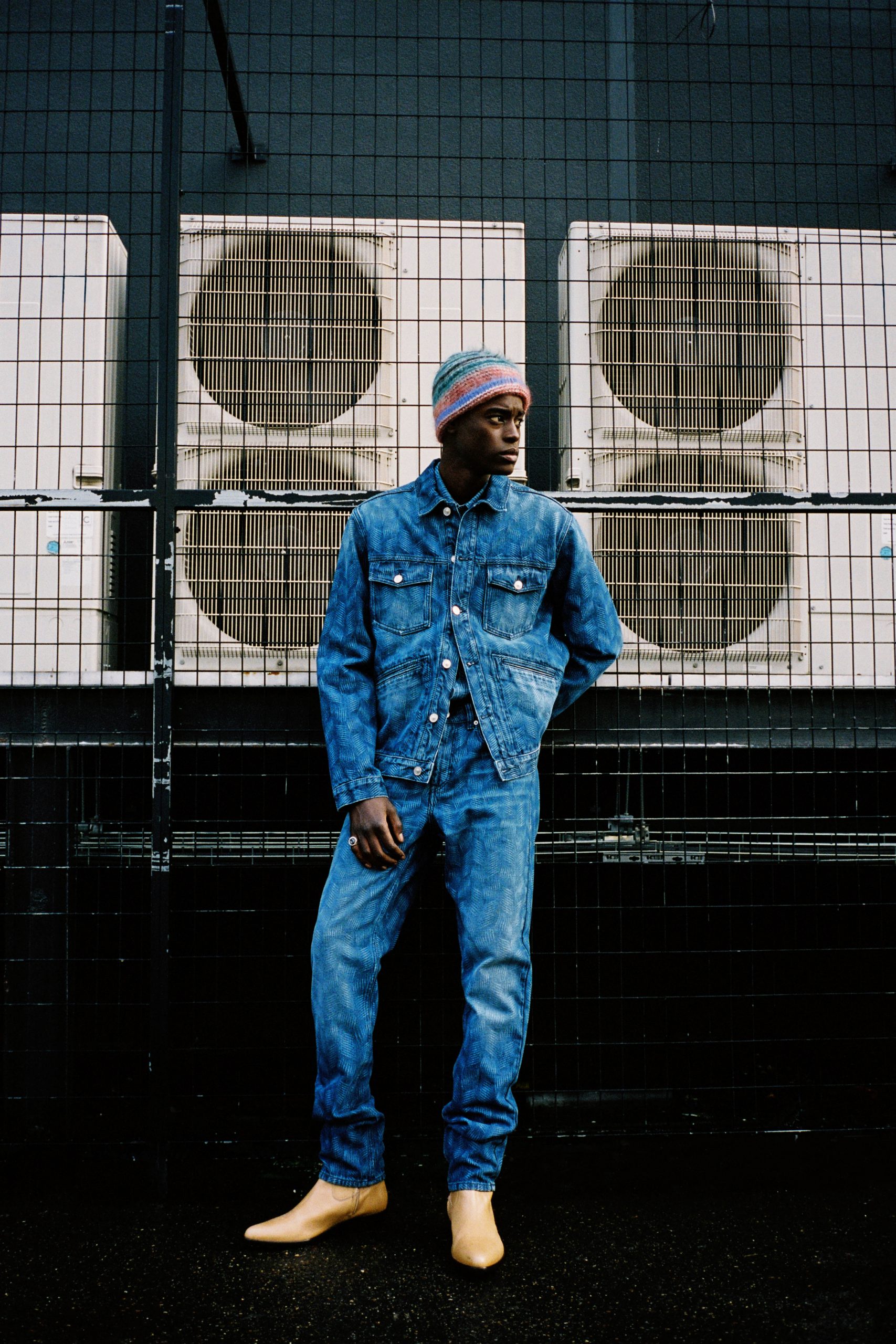 Black man in jeans and a beanie