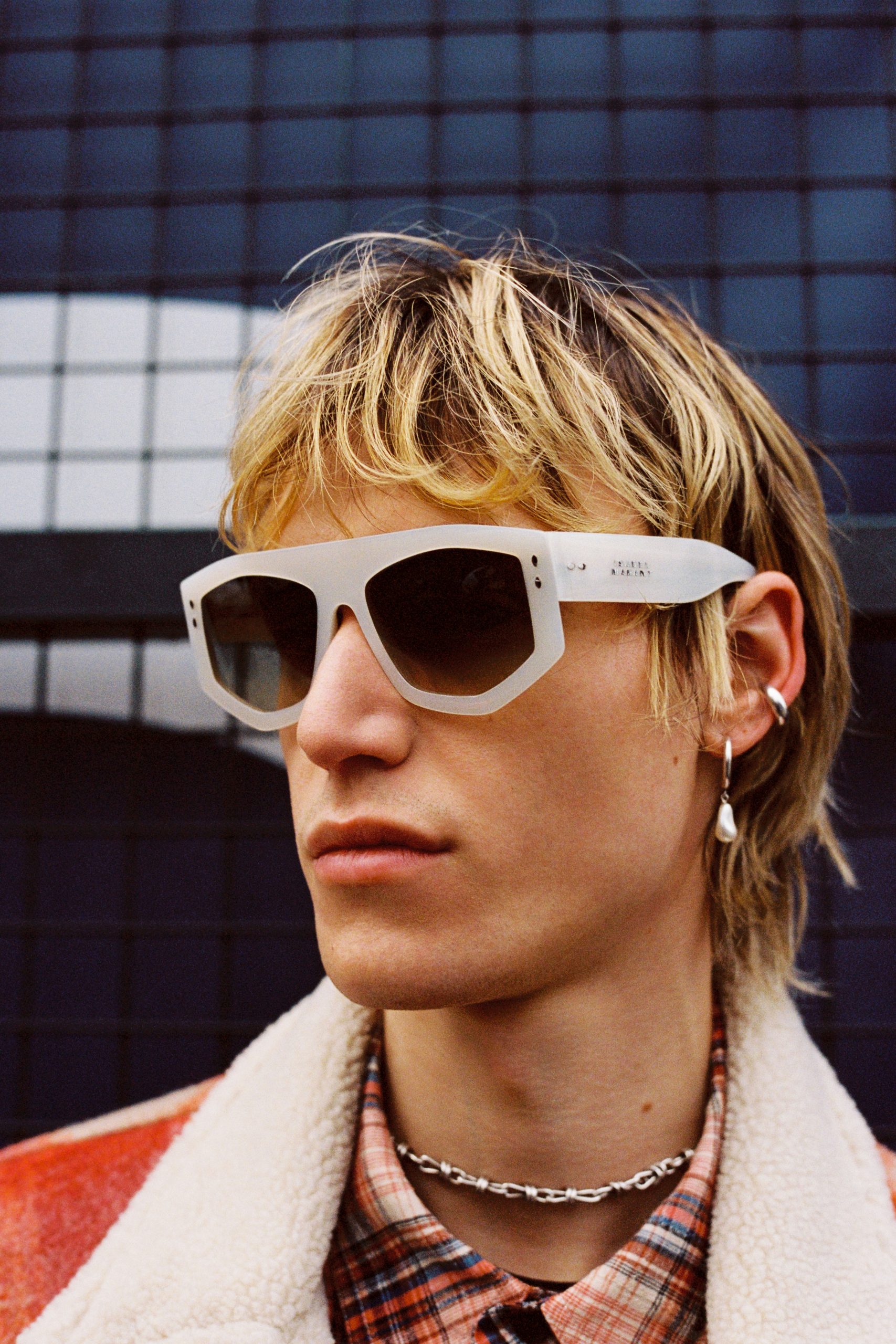 Blond man with white sunglasses