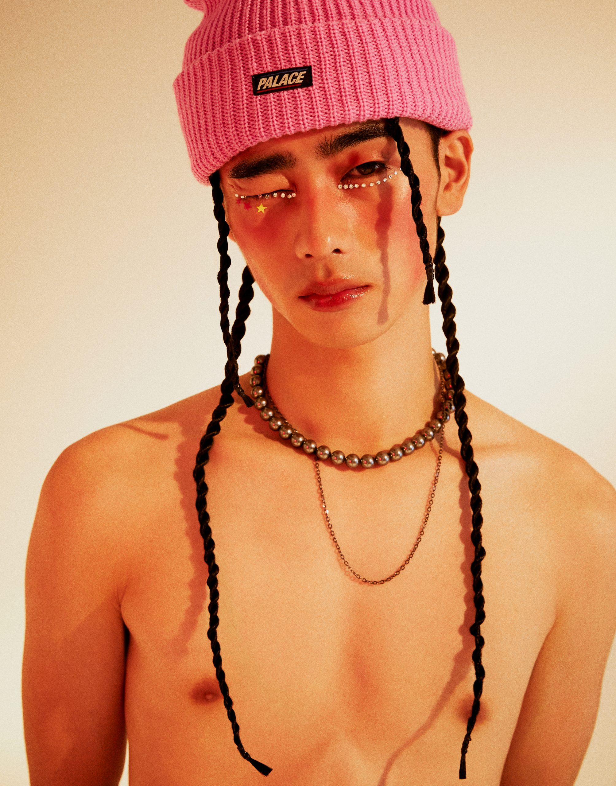 Man with pink beanie and long braids