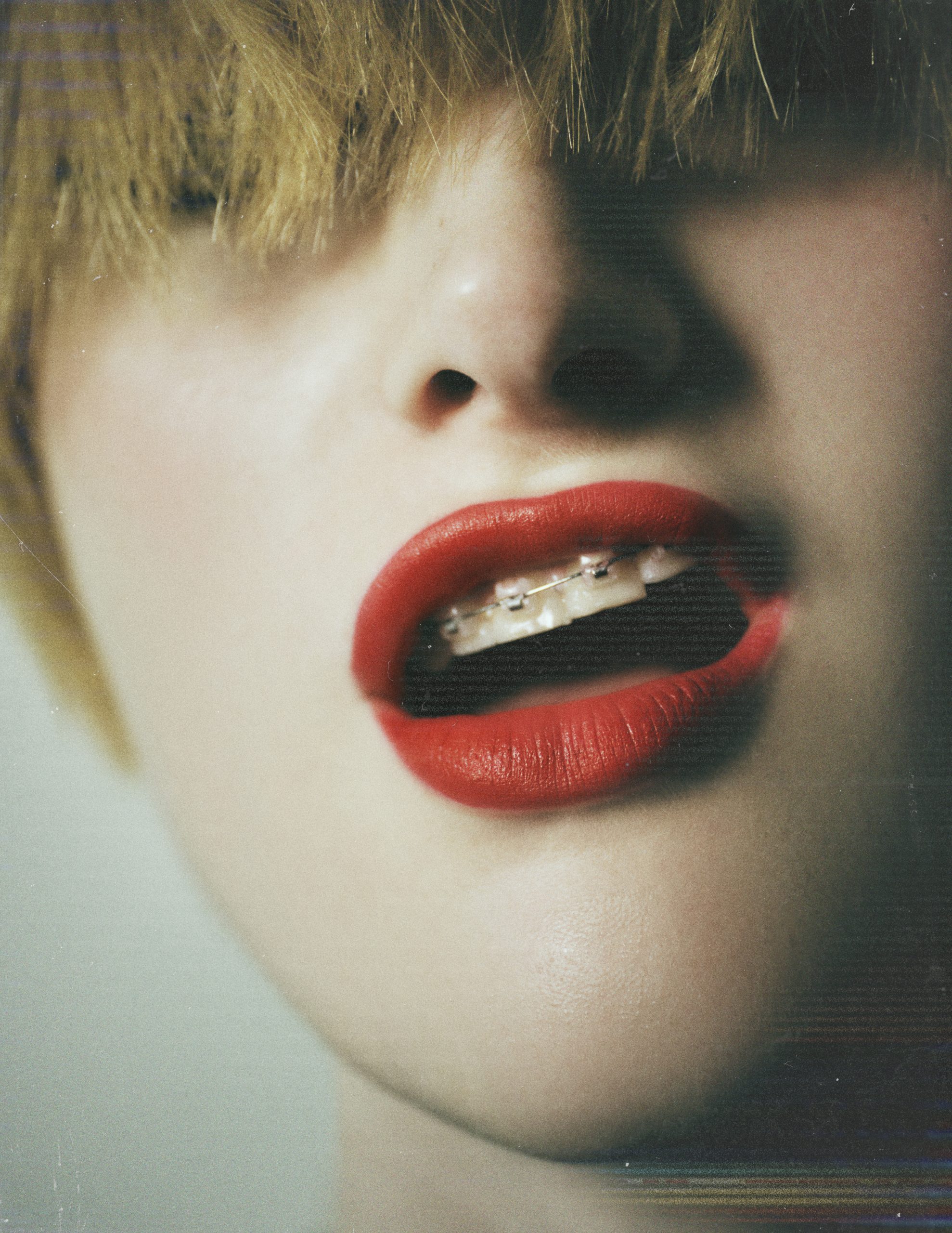 close-up of red lips and long bangs