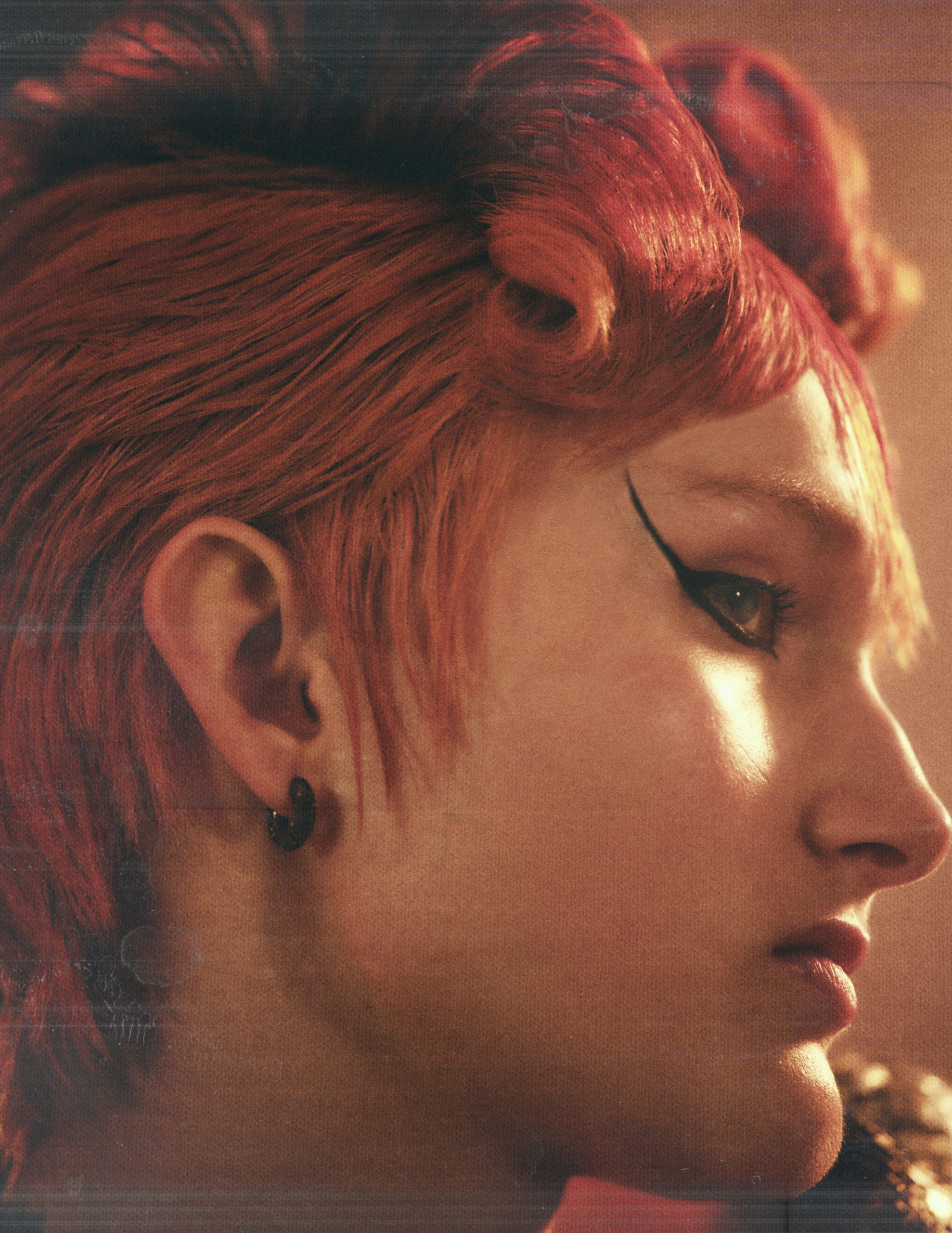 portrait of woman with black earrings