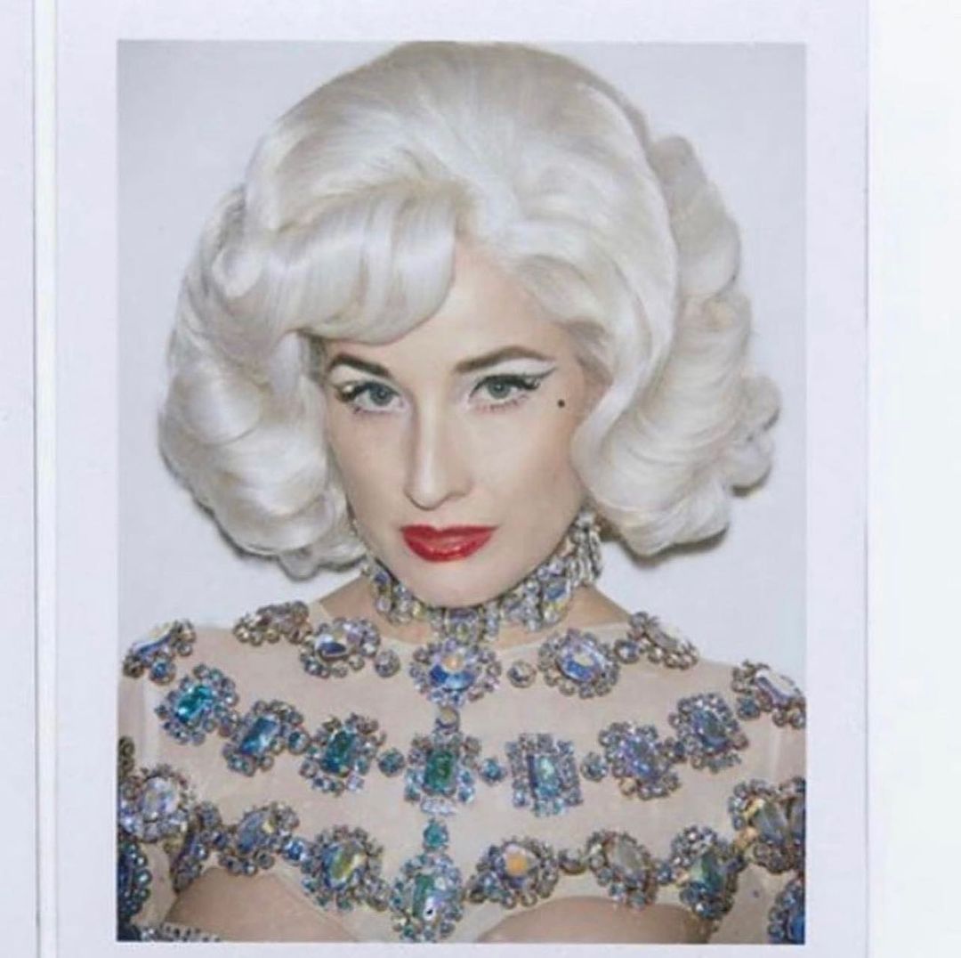 Dita von Teese in a big and blonde wig
