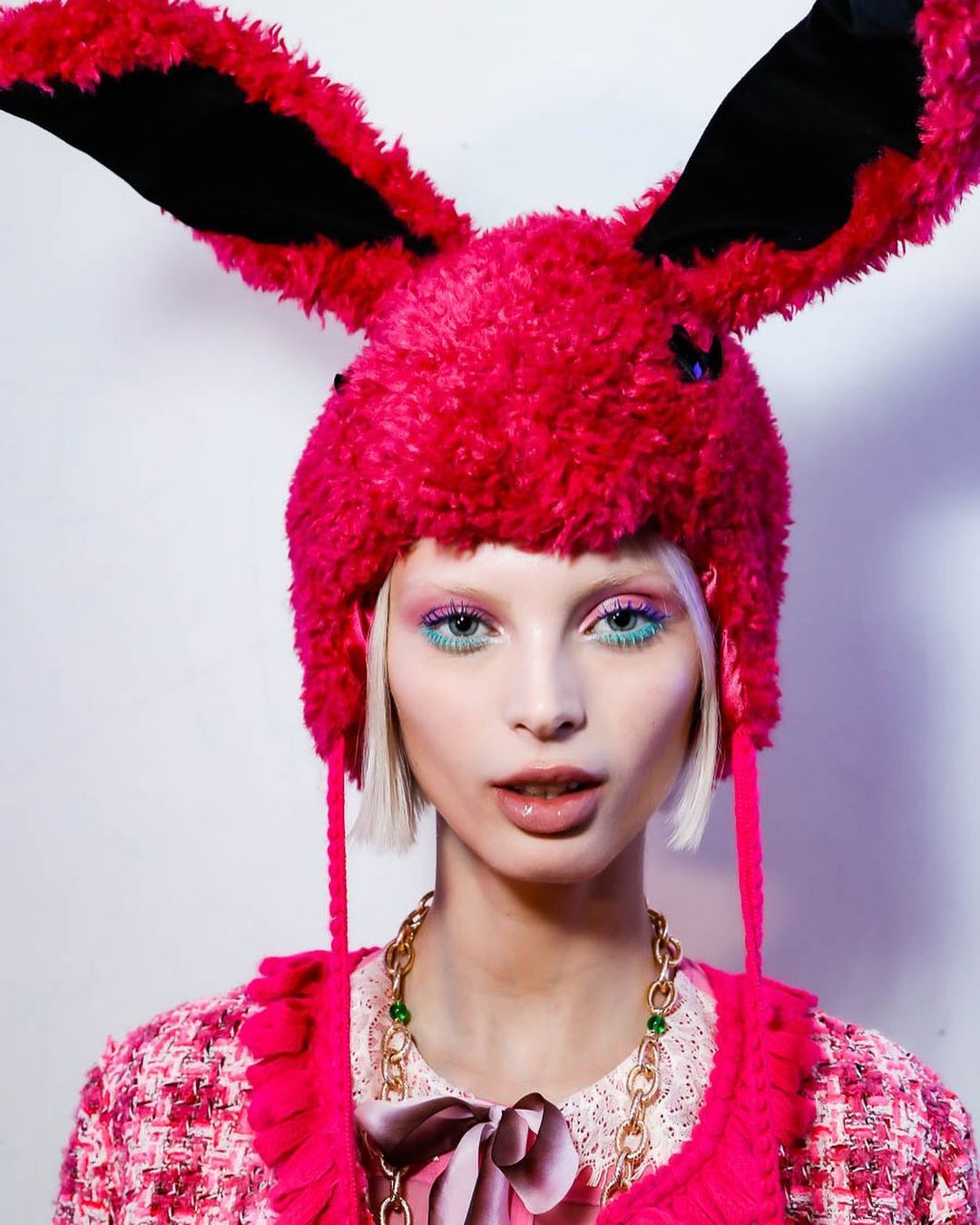 Woman with pink bunny ears