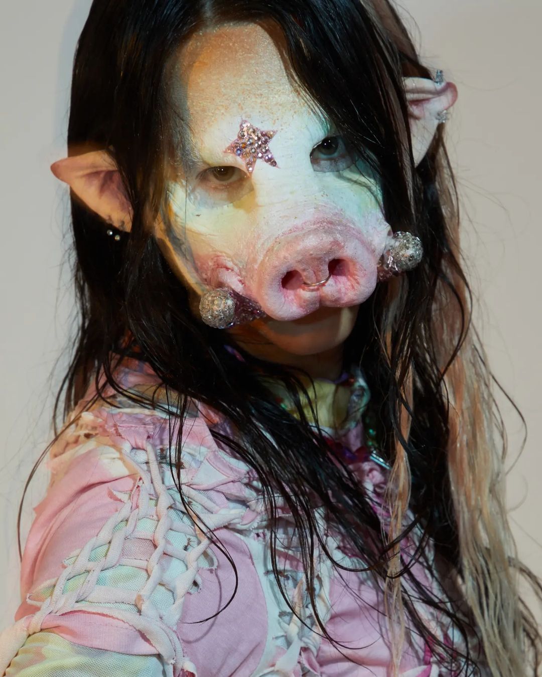 Model with pig face
